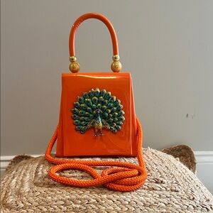 Elegant Orange Mini Bag with Peacock Accent